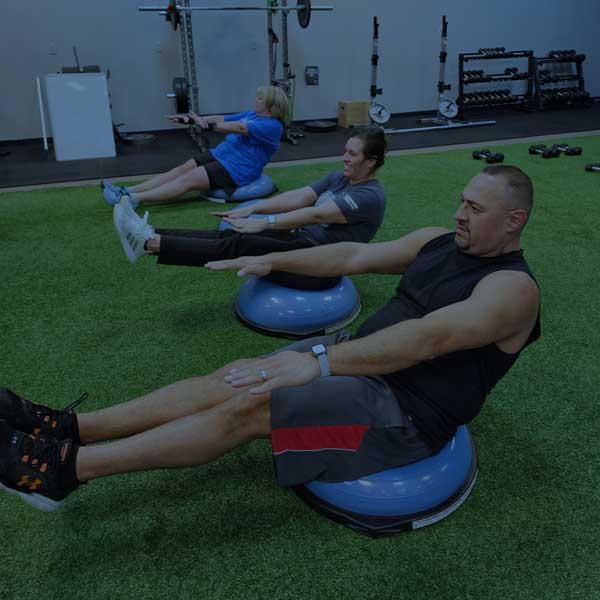 Full30Fit members completing a coached core exercise.